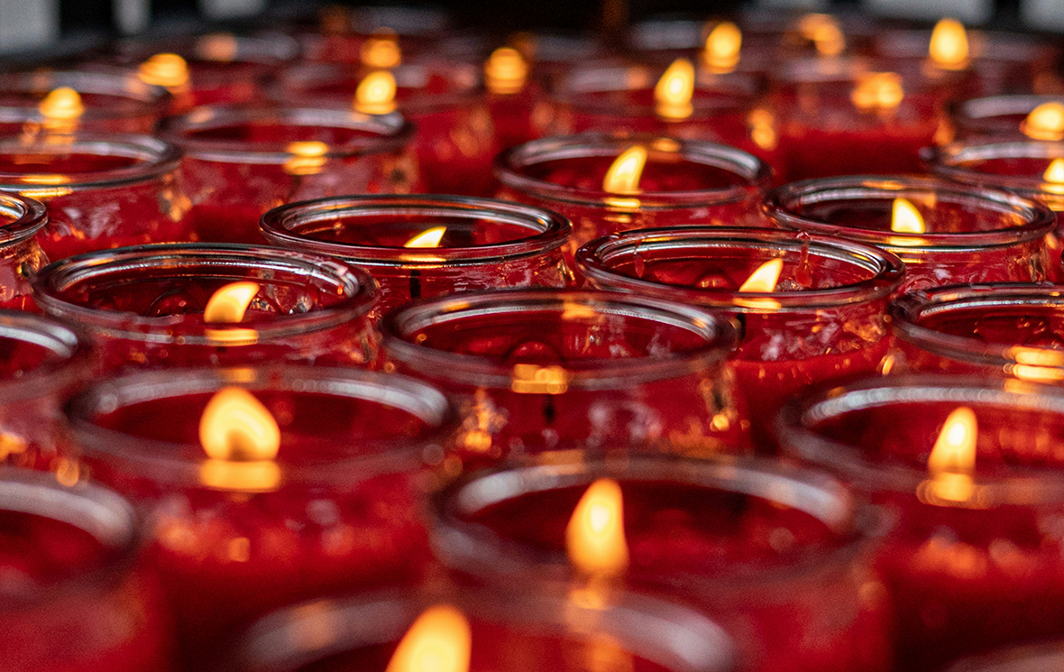 red candles, red mass image link to story