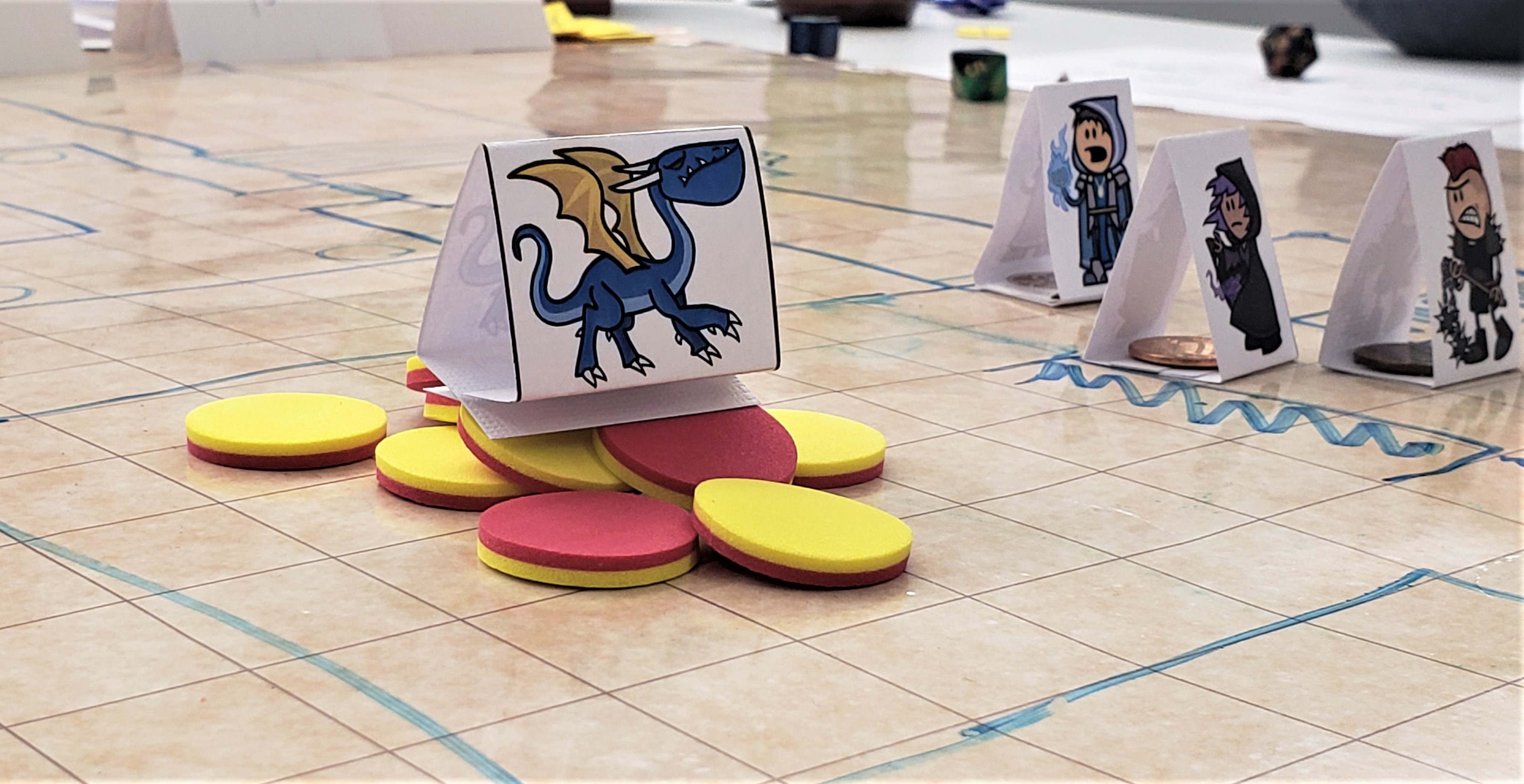 A game board with game pieces from D&D. It has a game piece with a picture of a Blue Dragon with yellow wings on top of red and yellow game chips. image link to story