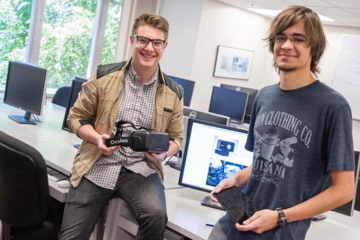 Bryce Mariano, left, and Paul Thurston show off the Oculus Rift and tablet that therapists employing their software can use to allay patients’ fears.