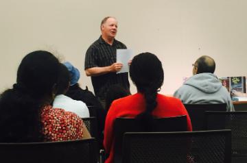 Staff presenting in front of audience 