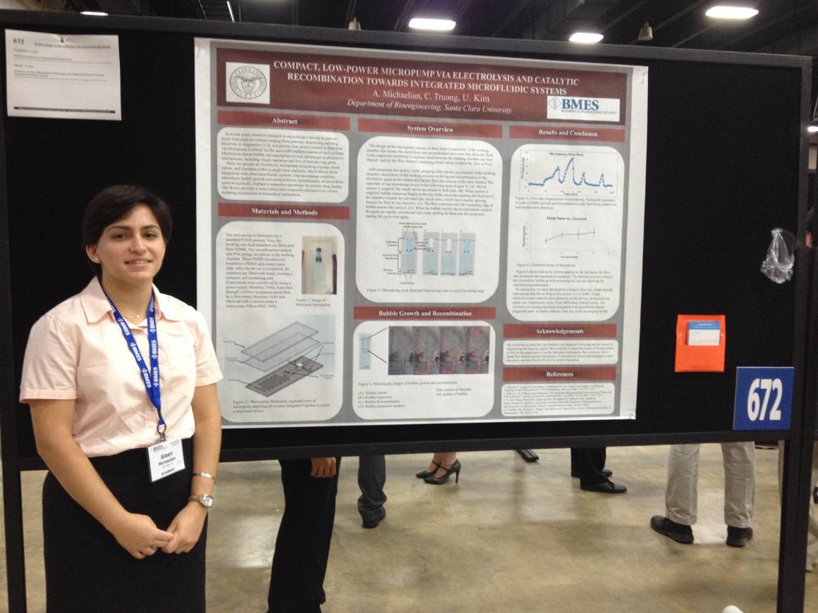Student presenting her poster at a conference