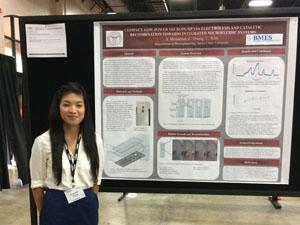 Student presenting her poster at a conference